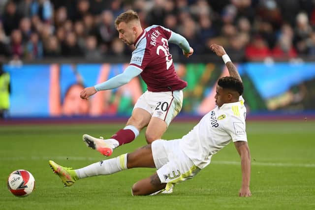 Junior Firpo challenges Jarrod Bowen during Leeds United's 2-0 FA Cup defeat to West Ham United at the London Stadium. Pic: Mike Hewitt.