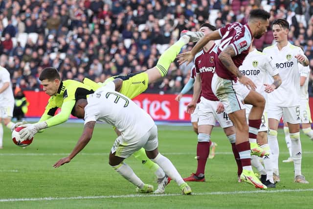 Illan Meslier and Junior Firpo collide during Leeds United's 2-0 FA Cup defeat to West Ham United at the London Stadium. Pic: Alex Pantling.