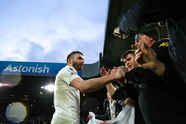 MILESTONE: Leeds United's Northern Ireland international Stuart Dallas with Whites fans in the Elland Road stands after his 250th appearance for the club against Burnley. Photo by Robbie Jay Barratt - AMA/Getty Images.
