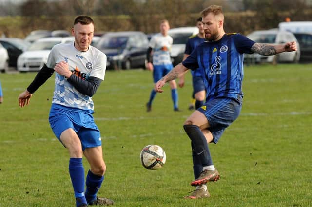 Tom Charles , right, shoots for Kippax Sundays under pressure from Old Crooked Clock's Jamie Kenny in the hosts' 5-1 West Riding County FA Sunday Trophy tie. Picture: Steve Riding.