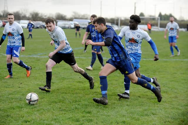 Kippax Sunday's Robbie Clayton finds space in the Old Crooked Clock defence. Picture: Steve Riding.