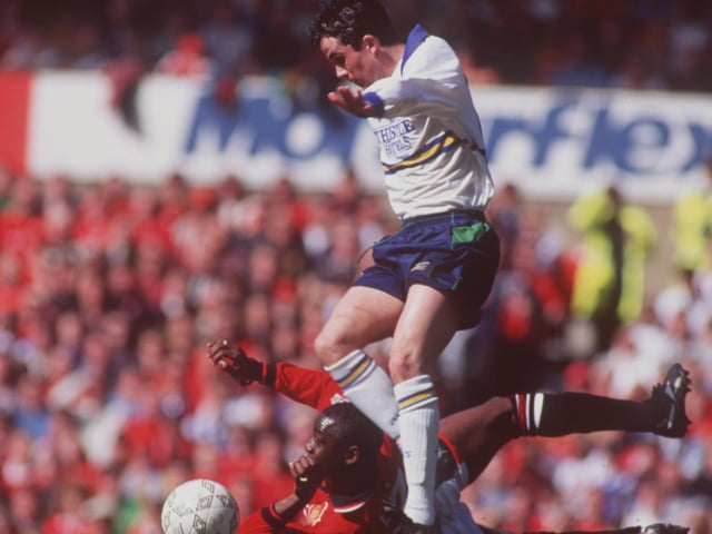 Gary Kelly leaves Manchester United striker Andy Cole in his wake during the Premier League clash at Old Trafford in April 1995. The game finished goalless.