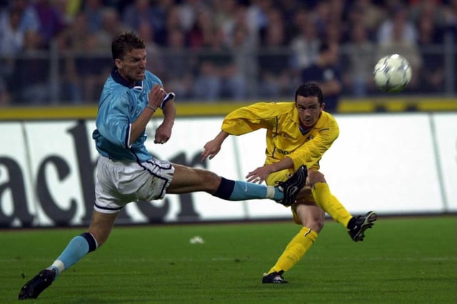 Gary Kelly shoots at goal during the Champions League third qualifying round, second leg against 1860 Munich at the Olympic Stadium in August 2000.