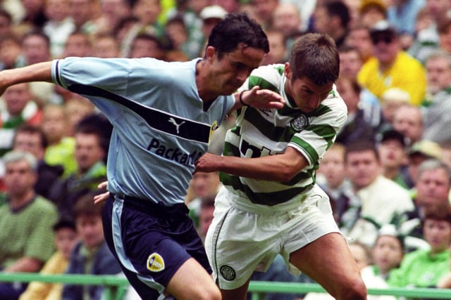 Gary Kelly tussles with Celtic's Mark Burchill during the pre-season clash at Celtic Park in July 1999.