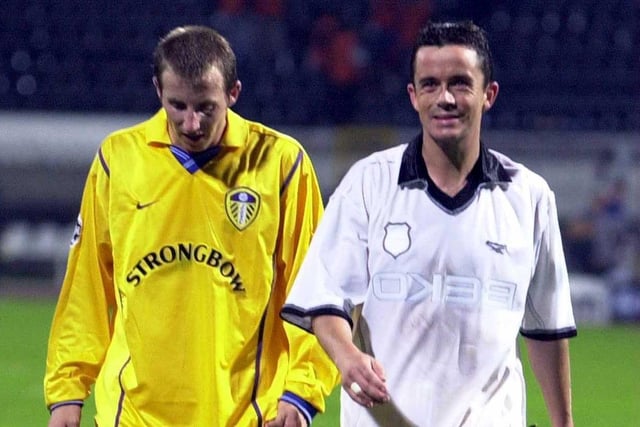 A beaming Gary Kelly walks off the pitch with teammate Lee Bowyer after Leeds United's goalless Champions League clash against Besiktas at the Inonu Stadium in October 2000.