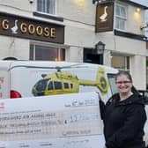 Jo Heywood, of the Gaping Goose in Garforth, presented Yorkshire Air Ambulance with a cheque for £12,000 after a year of fundraising events.