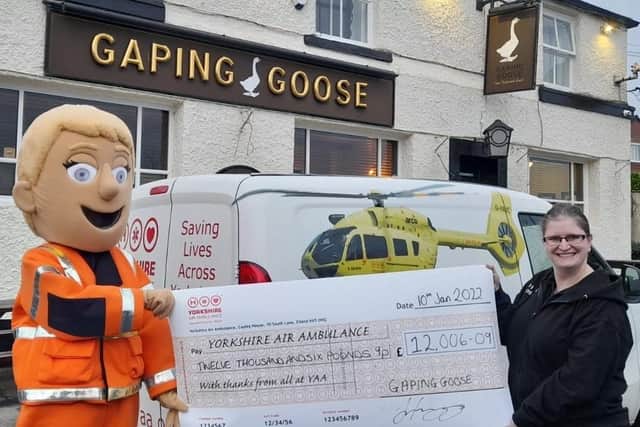 Jo Heywood, of the Gaping Goose in Garforth, presented Yorkshire Air Ambulance with a cheque for £12,000 after a year of fundraising events.