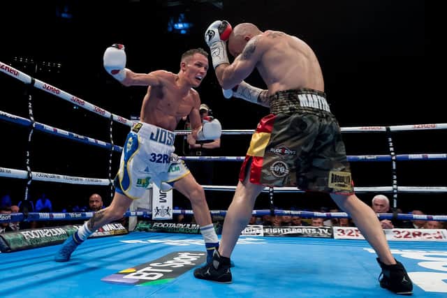 Josh Warrington on the attack against Kiko Martinez the last time they met at the Leeds Arena. Picture: James Hardisty.