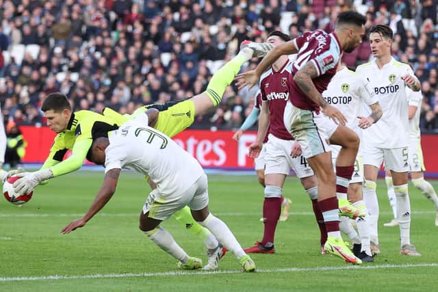COLLISION: Between Leeds United's Junior Firpo, bottom left, and goalkeeper Illan Meslier in last weekend's third round FA Cup clash at West Ham. Photo by Alex Pantling/Getty Images.