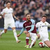 IMPRESSIVE DEBUT: Eighteen-year-old Leeds United defender Leo Hjelde, right, challenges West Ham's Nikola Vlasic upon his Whites debut during Sunday's third round FA Cup clash at West Ham. Photo by Alex Pantling/Getty Images.