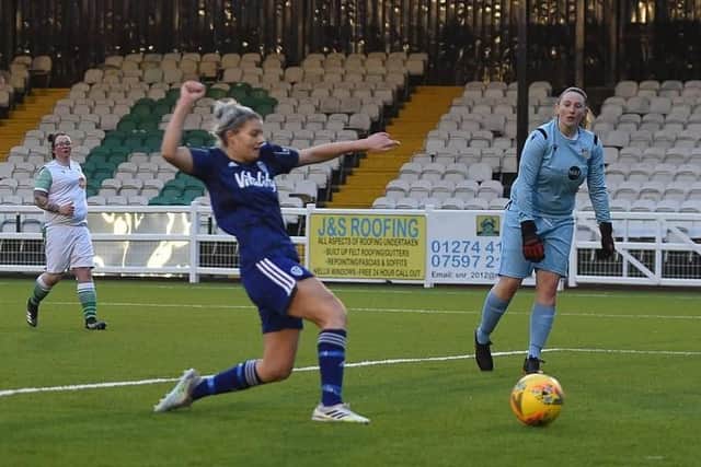 Sarah Danby pokes home her second goal during Leeds United's 13-0 County Cup win over Bradford Park Avenue. Pic: LUFC.