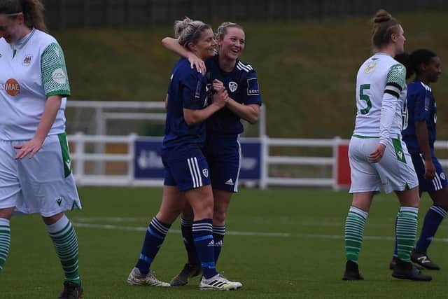 Sarah Danby celebrates with Leeds United team-mate Rebekah Bass during the Whites' 13-0 County Cup win over Bradford Park Avenue. Pic: LUFC.