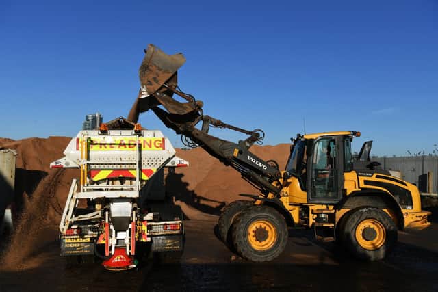 A gritting truck is loaded with eight tonnes of grit ahead of a routine grit run which will see it cover 30 miles worth of the city's road network in a three hour shift.