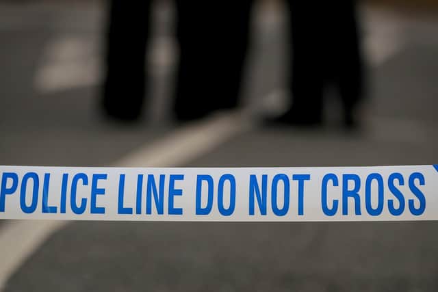 Homes were evacuated and a road closed in Leeds today as police and bomb disposal units dealt with devices found in a car.