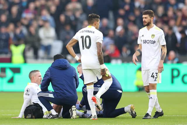 Leeds United's Adam Forshaw receives treatment on the pitch before being substituted. Picture: Alex Pantling/Getty Images.