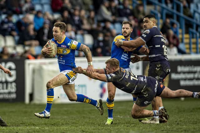 Richie Myler makes a break for Rhinos in the win over Featherstone. Picture by Tony Johnson.