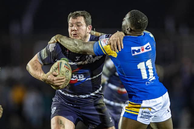 Rovers' former Leeds forward Brett Ferres tangles with ex-teammate Muizz Mustapha. Picture by Tony Johnson.
