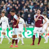 TOUGH SHIFT: West Ham United captain Declan Rice, right, looks on after Leeds United net for a third time through hat-trick hero Jack Harrison in Sunday's Premier League clash at the London Stadium. Photo by Alex Pantling/Getty Images.
