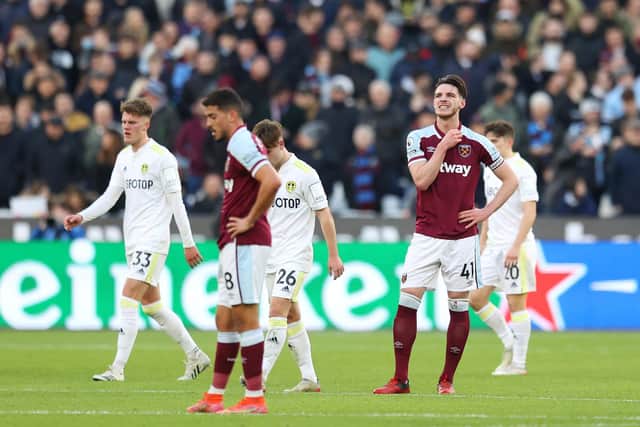 TOUGH SHIFT: West Ham United captain Declan Rice, right, looks on after Leeds United net for a third time through hat-trick hero Jack Harrison in Sunday's Premier League clash at the London Stadium. Photo by Alex Pantling/Getty Images.