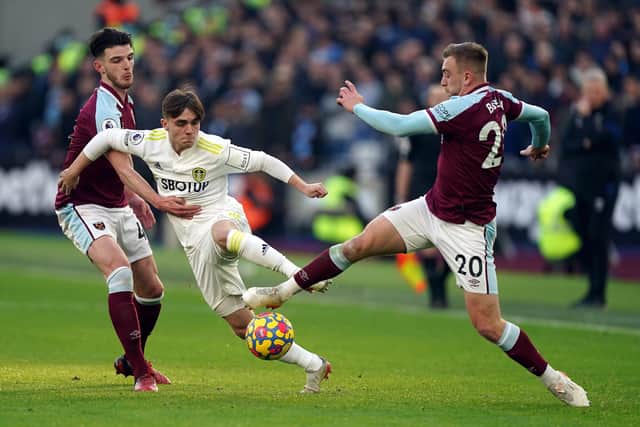 Leeds United's Lewis Bate battles for the ball with West Ham United's Declan Rice (left) and Jarrod Bowen (right). Picture: Mike Egerton/PA Wire.