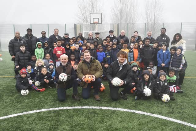 Chapeltown Juniors FC has unveiled its new artificial turf five-a-side pitch after a £24,700 donation from the North Leeds Lodge of Dawn Freemasons. Pictured at the front is Michael Rose, charity co-ordinator for Lodge of Dawn, Christian Higgins, Worshipful Master Lodge of Dawn and coach Jake Boyd