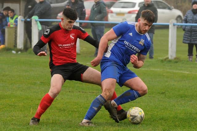 Nathaniel Wilson-Fleming, of Horbury Town, closes downKirk Deighton Rangers' Jake Little during Saturday's West Yorkshire League Premier clash. Picture: Steve Riding.