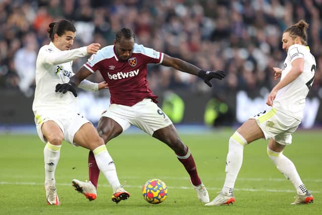 UP FOR THE FIGHT: Returning Leeds United centre-back Pascal Struijk, left, is quickly onto West Ham's powerhouse striker Michail Antonio in Sunday's 3-2 victory at the London Stadium. Photo by Alex Pantling/Getty Images.