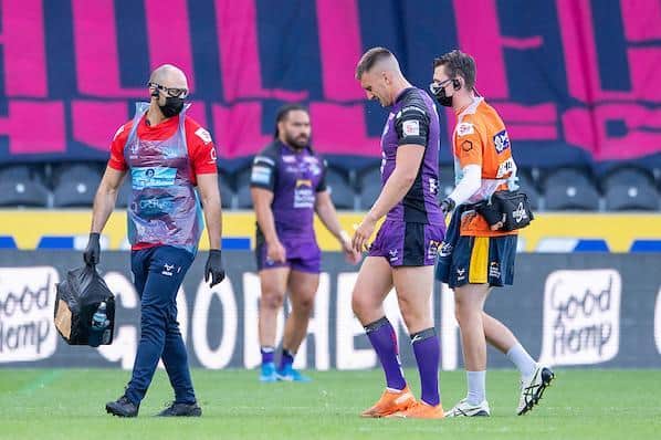 Alex Mellor hobbles off the field after suffering a season-ending knee injury against Hull last August. Picture by Allan McKenzie/SWpix.com.