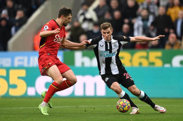 Chris Wood of Newcastle United battles for possession with Craig Cathcart of Watford FC during the Premier League match between Newcastle United and Watford at St. James Park on January 15, 2022 in Newcastle upon Tyne, England.