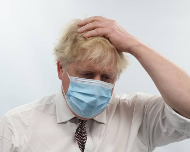Prime Minister Boris Johnson talks to staff during a visit to the Finchley Memorial Hospital in North London