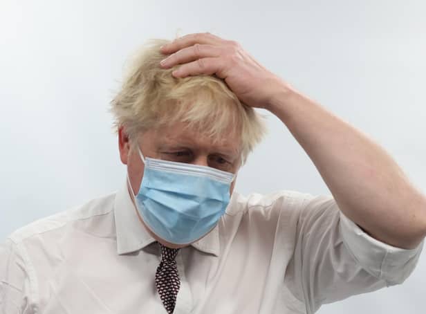 Prime Minister Boris Johnson talks to staff during a visit to the Finchley Memorial Hospital in North London