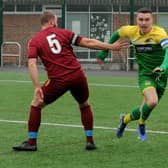 James Law, of Middleton, takes on Ben Binns of Calverley United. Law scored a hat-trick in the 5-0 win over their Yorkshire Amateur Supreme rivals. Picture: Steve Riding.