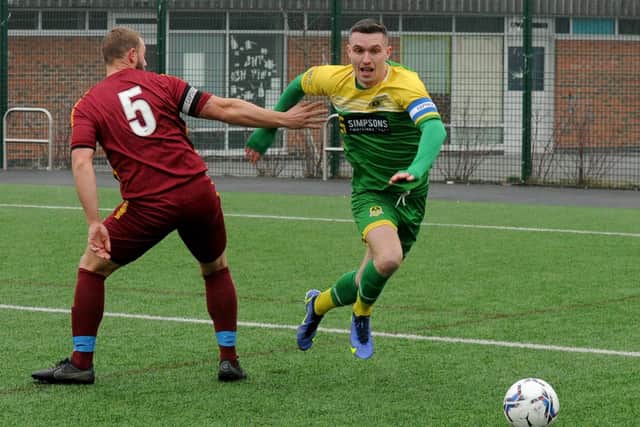 James Law, of Middleton, takes on Ben Binns of Calverley United. Law scored a hat-trick in the 5-0 win over their Yorkshire Amateur Supreme rivals. Picture: Steve Riding.