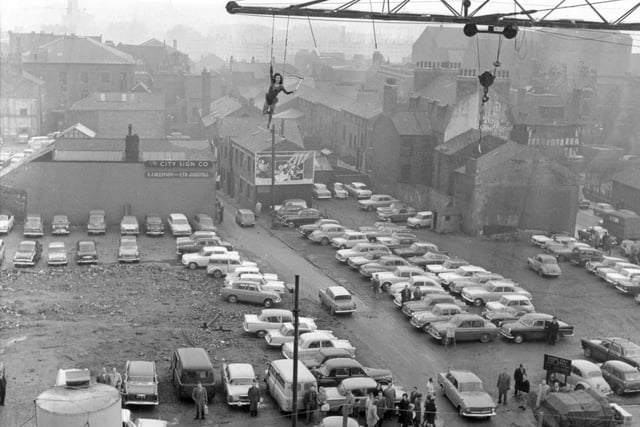 Dutch trapeze artist, Ria Roeber, can be seen swinging from a crane 100ft above Wade Lane in Leeds city centre in December 1963. This was a publicity stunt for Billy Smart's circus. PIC: West Yorkshire Archive Service