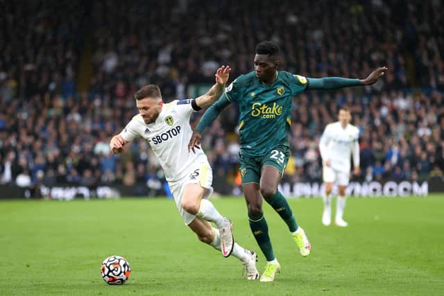 Ismaïla Sarr and Stuart Dallas tussle for the ball during Leeds United's 1-0 win over Watford at Elland Road in October. Pic: Alex Pantling.