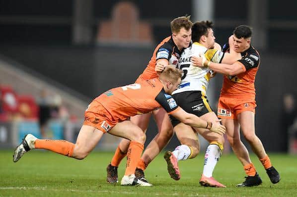 James Clare, left, tackles York's Will Oakes, along with Castleford teammates  Sam Hall and Cain Robb. Picture by Will Palmer/SWpix.com.