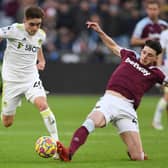 IMPRESSIVE: Leeds United's Lewis Bate, left, battles it out with West Ham captain Declan Rice in the 3-2 victory at the London Stadium on the 19-year-old midfielder's Premier League debut. Photo by DANIEL LEAL/AFP via Getty Images.
