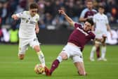 IMPRESSIVE: Leeds United's Lewis Bate, left, battles it out with West Ham captain Declan Rice in the 3-2 victory at the London Stadium on the 19-year-old midfielder's Premier League debut. Photo by DANIEL LEAL/AFP via Getty Images.