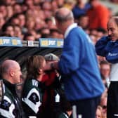 TOON BLUES: Referee David Elleray puts on a Leeds United training top to avoid his black shirt clashing with Newcastle United's dark strip during the Premier League clash at Elland Road of October 1997. Picture by Varleys.