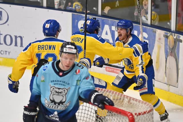 PERFECT TIMING: Cole Shudra celebrates with Matty Davies and Kieran Brown after clinching a dramatic late win for 
Leeds Knights over Sheffield Steeldogs 
Picture: Bruce Rollinson