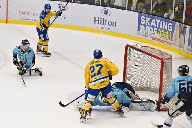 MAGIC MOMENT: Cole Shudra forces the puck past Dmitri Zimozdra with seven seconds remaining to earn Leeds Knights a thrilling 4-3 win over Sheffield Steeldogs 
Picture: Bruce Rollinson