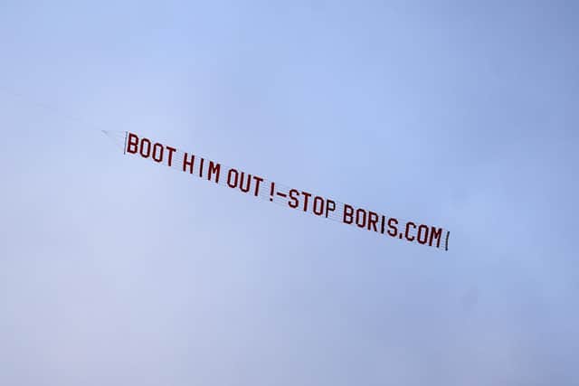The sign read "Boot him out - stop Boris". PA.