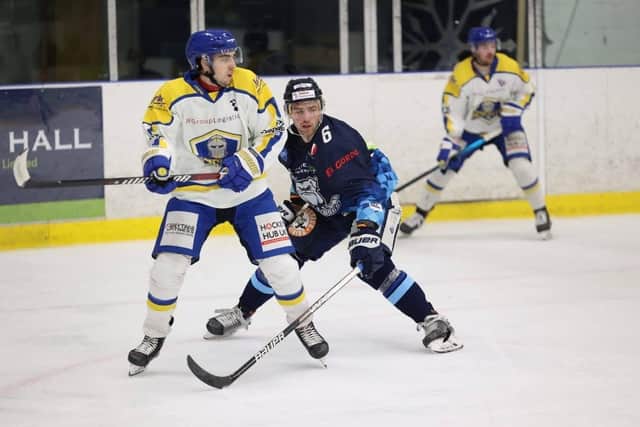 Leeds Knights' forward Ethan Hehir, left, comes under pressure from Sheffield Steeldogs' Ben Morgan at Ice Sheffield. Picture courtesy of Peter Best/Steeldogs Media
