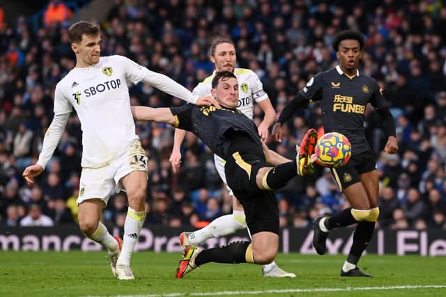 Former Leeds United striker Chris Wood attempts a shot for Newcastle United as Diego Llorente puts him under pressure. Picture: Stu Forster/Getty Images.