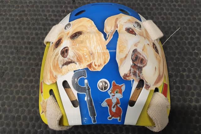 Treasured family pets 'Cali' left and 'Millie', right, adorn the backplate of Sam Gospel's helmet, along with other personal images relating to his family.
