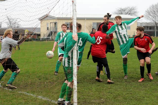 David Allanson, of Oakley, rises high to score in the 3-1 Leeds Combination League Division 3 win over Republica Internationale. Picture: Steve Riding.