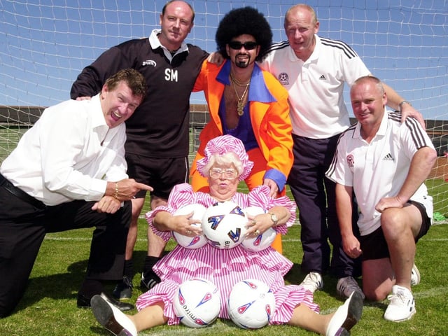 This photo was taken in 2003 and depicts a Celebrity Football Spectacular at Blackpool FC's training ground. Tony Jo is pictured left with BFC manager Steve McMahon, Lionel Vinyl, community officer for BFC Derek Spence, ex Blackpool footballer Dave Tong,  and at the front is Mo Moreland.