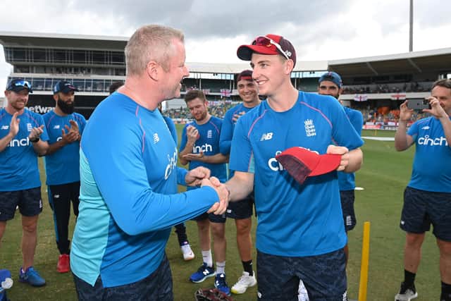 PROUD MOMENT: Yorkshire batsman Harry Brook receives his England cap from Anthony McGrath ahead of yesterday's T20 International against the West Indies. Picture: Gareth Copley/Getty Images.
