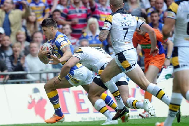 Tom Briscoe scores for Rhinos against Castleford in the 2014 Challenge Cup final. Picture by Steve Riding.