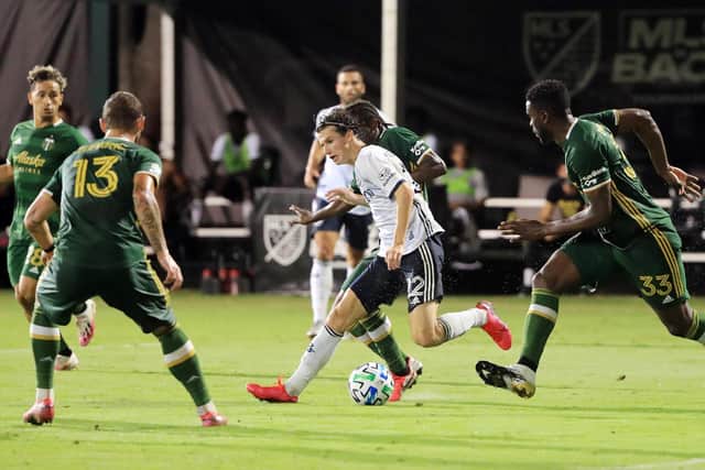 IMPRESSIVE: A 19-year-old Brenden Aaronson, centre, takes on all comers for Philadelphia Union against Portland Timbers during the MLS Is Back Tournament semi-finals in Florida in August 2020. Photo by Sam Greenwood/Getty Images.